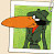 A pixelated character with dark green fur, white eyes, and a red scarf stands against a green background holding an orange object.