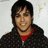 Pixelated image of a person with dark hair wearing a dark patterned jacket over a red shirt, with pink text reading 'Pete' and 'Thanks 4 The Memories' on a black background.