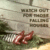 Pixelated static image shows two red fish-like creatures on green foliage with blurred text blocks in the background.