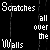 Black background with white pixelated text fragments arranged in vertical , displaying repeated phrases like 'Scratches', 'Walls', 'Just', 'like my', and 'BROKEN HEART' across multiple