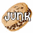 A pixelated chocolate chip cookie with 'JUNK' text overlaid on top, displayed in a
