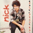 Pixelated image of a person in casual clothing holding an object, with red vertical text on the left side.