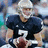 Pixelated image of a person in dark sports uniform holding a football, next to yellow background with blue text reading JIMMY CLAUSEN IS AMAZING.