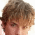A pixelated image shows a person with light brown hair and multiple silver necklaces, overlaid with text reading "I ❤️ Jeremy Sumpter" in black font on white background.