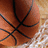 A basketball with black lines on a wooden court background, featuring blue text reading 'mendra' in the lower right.