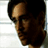 A 48x48 pixel animated contact sheet showing three sequential frames of a man with dark hair and glasses in different indoor settings, each frame cropped to show his upper body or head against light backgrounds.