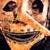 Pixelated static image of a cartoonish face with exaggerated features and warm color tones.