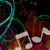 Pixelated image with musical notes and abstract colorful lines on a dark background.