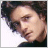20 pixelated frames showing a person with curly brown hair against a white background, each frame containing pink text at the bottom