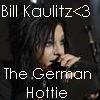 A static image shows a person with dark hair and a black jacket, with text overlays reading 'Bill Kaulitz<3' and 'The German Hottie' in white pixelated font.