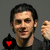 Four pixelated portraits of a man with varying expressions and backgrounds, each featuring a black spade symbol with a red heart inside at the bottom left.
