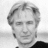 Black-and-white pixelated image of a person with light hair and dark clothing, next to text reading 'Alan Rickman' on black background.