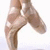 Pixelated image of a person's legs in ballet pose with text overlays asking if balancing looks easy and suggesting trying it in arabesque.