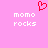 A static pixel art icon with a pink background, red heart symbol above text reading 'momo rocks' in white block letters.