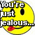 A four- pixel art image with text overlays: a yellow smiley face, a pink-haired character, a blue dinosaur, and a heart-filled background