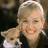 A 48x48 pixel buddy icon featuring a person with short blonde hair holding a small dog, next to green text reading "Original Icons .com" on a dark background.