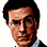 Pixelated static image of a man's face with dark hair and formal attire against white background.