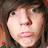 A person with brown hair and blue eyes appears in four showing subtle facial expression changes