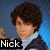 Pixelated image of a person with brown curly hair wearing a light blue shirt and dark jacket against a gradient background, with 'Nick' text overlay.