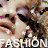 Pixelated image of a person with dark hair and light skin, wearing white text reading 'A. SHION' at the bottom.
