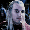 A four- shows a person with long light hair in a dark red garment with circular patterns, against a dark background with blue highlights