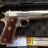 A pixelated static image of a handgun with a brown grip and metallic barrel, positioned horizontally against a dark background with blurred colored elements below.