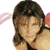 Static pixelated image of a person with brown hair and pink ear accessories against white background, rendered in low-resolution style typical of early 2000s instant messaging icons.