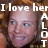 Pixelated image of a person with light skin and blue eyes, overlaid with white text reading "I love her A LOT" in a blocky font.