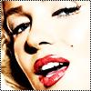 Close-up of a person's face with red lips, dark eyeliner, and blonde hair, cropped to show only the lower half of the face.
