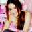 Pixelated image of a person with long brown hair in a pink top, surrounded by pink plush toys, with pink text reading "Miley Cyrus Rocks!!!" and "Let's go GHO!!!" on light backgrounds.