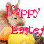 Pixelated image of a rabbit-like creature wearing a yellow shirt with red text reading 'Happy Easter' overlaid.