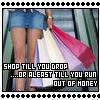 A person in blue denim shorts holds multiple shopping bags while standing on an escalator, with overlaid text reading "SHOP TILL YOU DROP ...OR ALEAST TILL YOU RUN OUT OF MONEY".