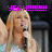 Pixelated image of a person with long blonde hair holding a microphone, overlaid with bright purple text reading YEAH!!!!!!!!