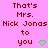 Pixelated text on pink background with two identical side-by-side phrases and green heart symbols.