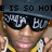 Pixelated image of a person wearing dark sunglasses with white text on lenses, yellow shirt, and raised hand gesture under partial text overlay.