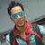A pixelated image shows a person wearing blue-tinted sunglasses and a red-accented jacket over a light blue shirt, next to a bright yellow background with 'Pollito!' text.