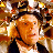 Pixelated static image of a person with curly brown hair and orange skin tones against a warm-toned background with yellow and red accents.