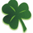 Green four-leaf clover with light green veins on a white background, rendered in pixelated style.