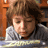 A child with brown hair in a gray shirt appears across multiple , some showing text overlays and a fish prop