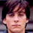 Static 48x48 pixel icon showing a close-up of a person's face with dark hair and neutral expression, rendered in low-resolution pixel art style on black background.