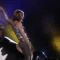 A sequence of animated frames showing a woman in multiple poses on stage with yellow and blue lighting.