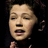 Pixelated image of a person with dark hair against black background, red text "love Damia" repeated in two horizontal lines.
