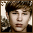 A 4-frame contact sheet of a pixelated animated icon showing a young man with brown hair in various facial expressions and slight head movements against a blurred background.