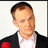 Pixelated image of a person in a black jacket with a red flower, white shirt, and light pink tie, next to text reading 'STEPHEN COLBERT=' and 'HAWT REPORTER BABIES' on black and gray backgrounds.
