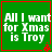 Green square icon with white text reading 'All I want for Xmas is Troy' and red border, featuring pixelated animation changes in the bottom-right corner