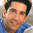 A pixelated image shows a person with dark hair wearing a blue and white striped shirt against a gray background, next to a solid blue displaying four stacked 'the' texts