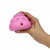 A pixelated hand holds a pink, rounded object with a small dark center against a white background.