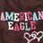 Pixelated image split into two sections: left side shows 'AMERICAN EAGLE' text with heart symbols on brown background, right side displays 'Love' text with blue pixel art heart on cyan background.