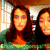 Two women with long brown hair in green tops stand side-by-side against a windowed background with a wooden frame.