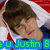 Pixelated image of a person with brown hair wearing a white and red top, with green text reading 'u Justin B' on a blue background.